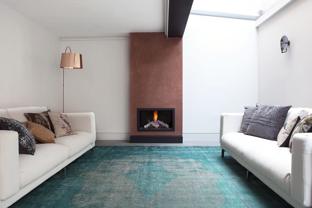 teal rug in living room