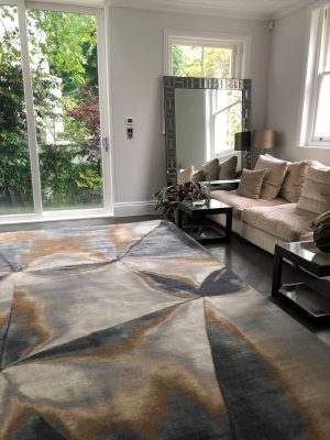 luxury wool and silk hand knotted rug with ceam sofa