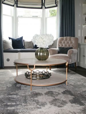 silver silk modern rug with pattern in contemporary living room with bay window
