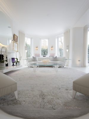 grey and pink luxury rug in contemporary living room