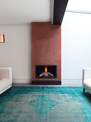 teal vintage overdyed rug in modern sitting room