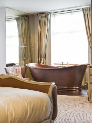 modern taupe rug with zebra pattern in bedroom