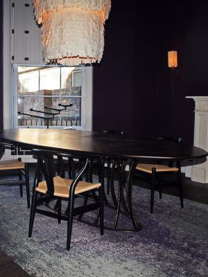 purple abstract rug in dining room with purple walls