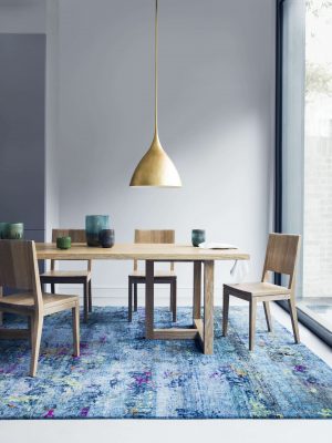 blue modern rug with wooden table by I&JL Brown