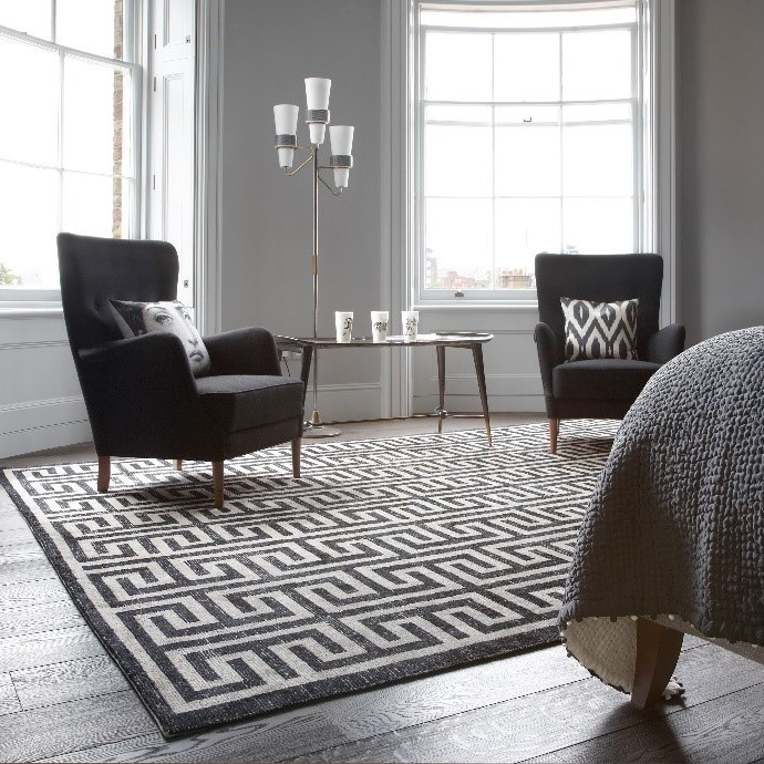 Black and white geometric rug with Greek key design