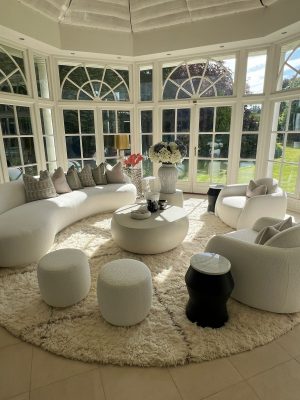 Luxury designer rug in a conservatory setting in London
