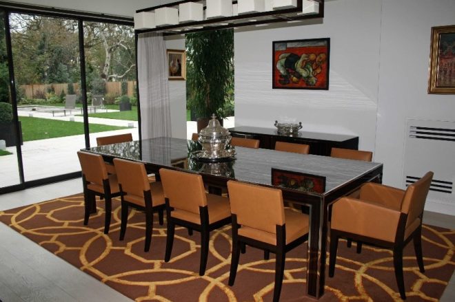 Brown geometric rug in dining room