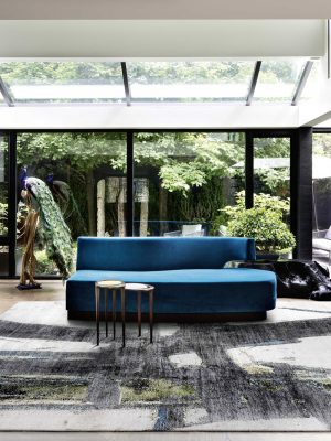 block no.07 rug in living room with blue sofas