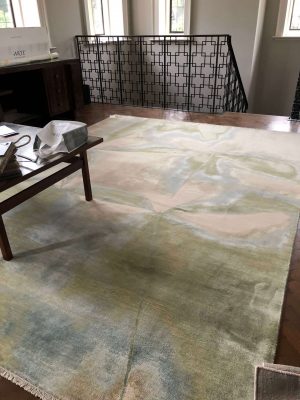 luxury handmade rug with wool and silk and green and blue design