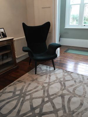 luxury rug in london home with green chair