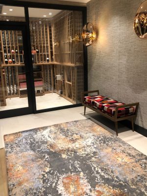 multi-coloured wool and silk abstract rug in hall