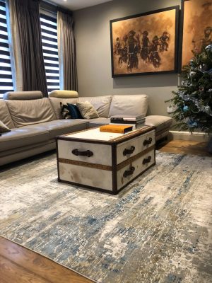 blue and white abstract rug in living room