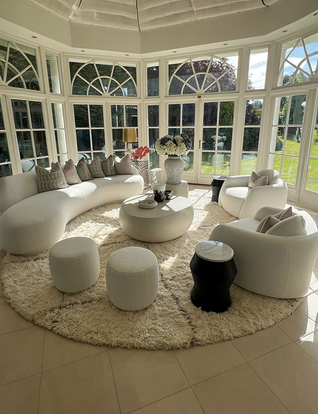 Luxury designer rug in a conservatory setting in London